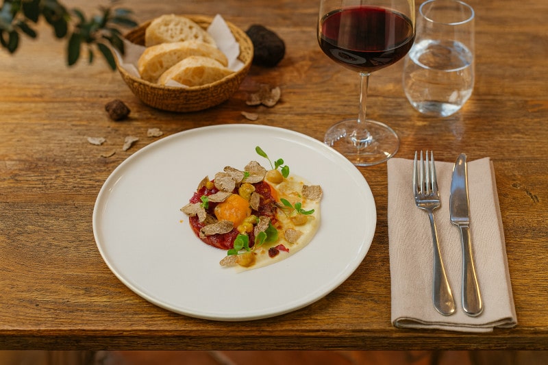 Wine with the meal Carne cruda all'Albese with Dolcetto d'Alba, Italian terrace, Mediterranean atmosphere