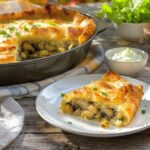 Wine with the meal Mushroom strudel with leek and herb cream, served with a glass of Grüner Veltliner from the Kamptal, Austria